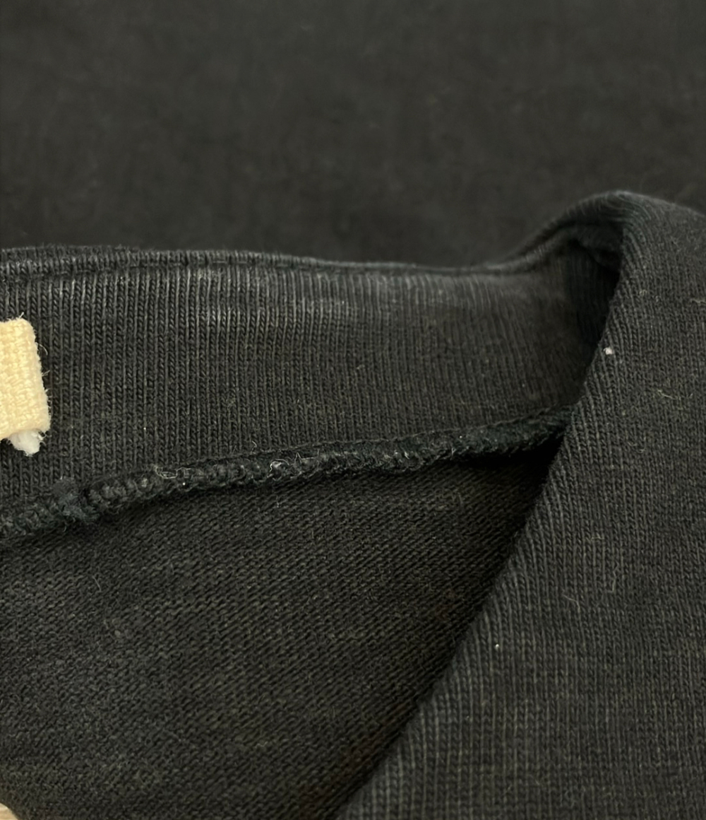Giacca nera Marni senza collo, con cerniera decentrata e inserto plissettato sul davanti, appesa a una gruccia. — vista 5