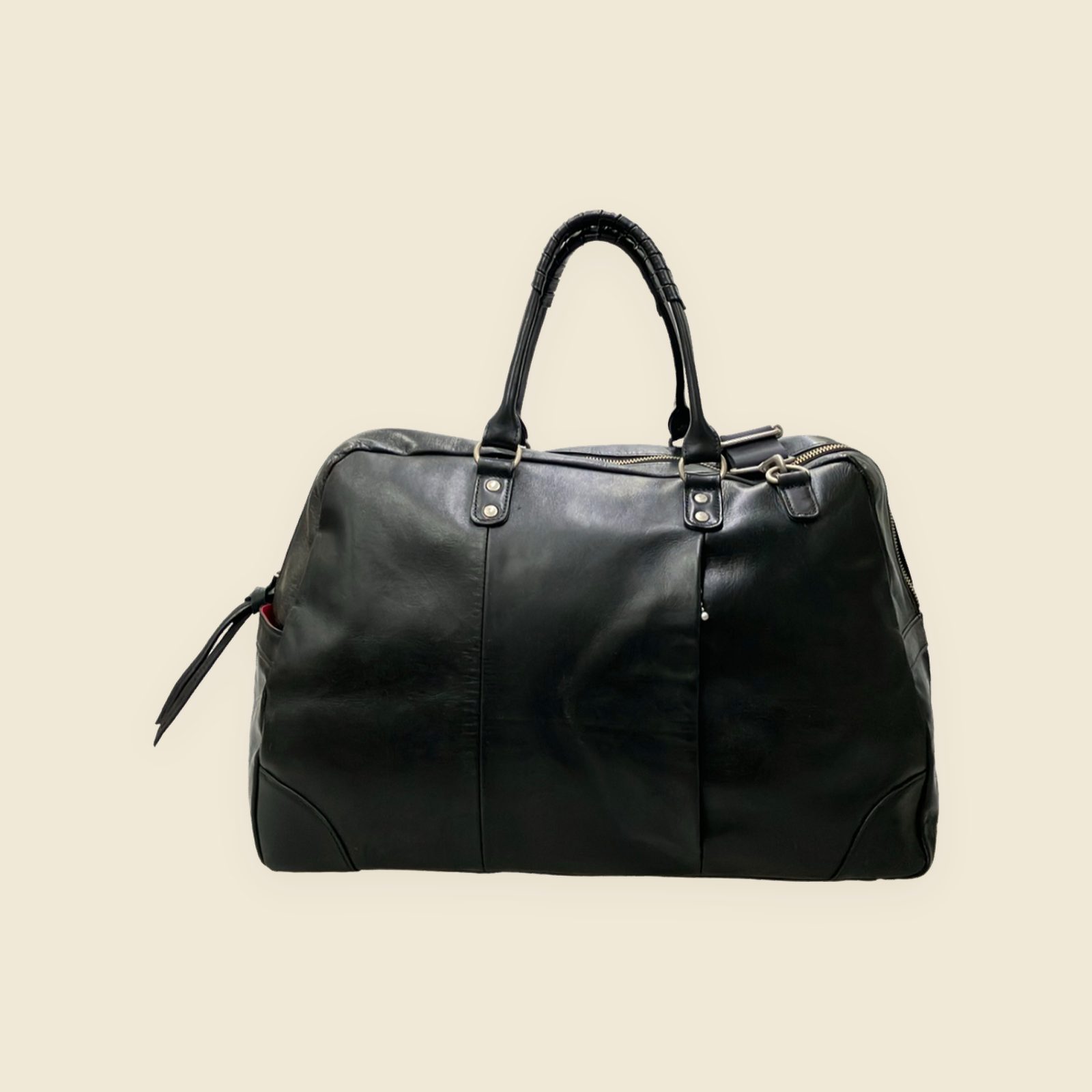 Borsa da viaggio Creed nera a due manici con tracolla larga, chiusura a cerniera e nappina laterale, vista frontale — vista 2