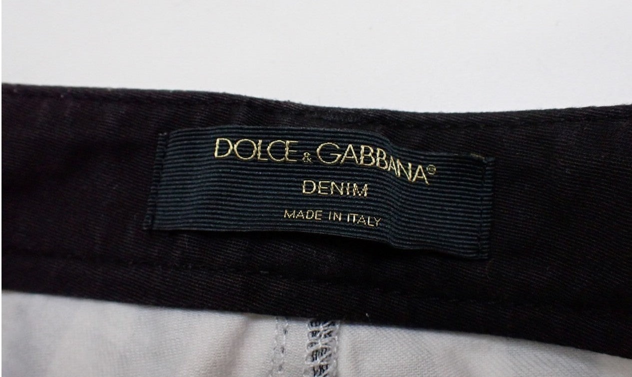 Pantaloni aderenti Dolce&Gabbana a righe verticali nere e bianche, indossati, con bottone in vita e tasche anteriori. — vista 6