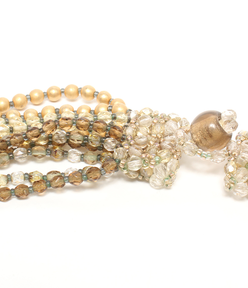 Collana multifilo Maria Calderara di perline sfaccettate e sfere opache color oro, dal champagne al bruno, su fondo bianco — vista 7