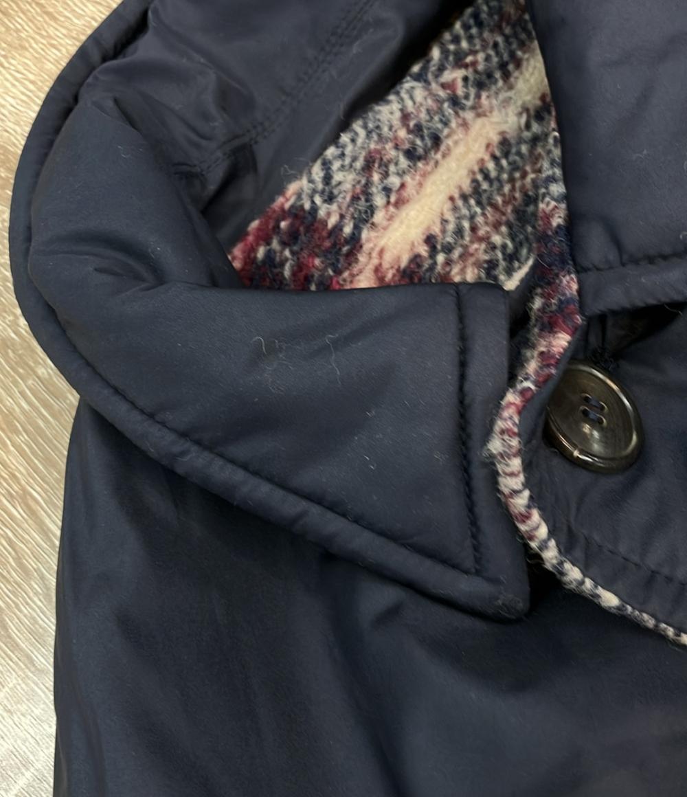 Cappotto Isabel Marant in lana a quadri beige, rosso e blu, colletto blu scuro, appeso a una gruccia su fondo bianco — vista 4