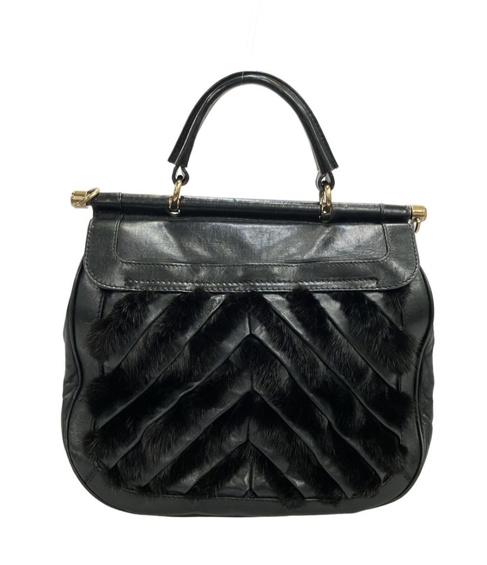 Borsa a mano Bally in pelle nera con manico singolo, chiusura girevole dorata e fasce di pelo scuro a punta sul fronte — vista 2