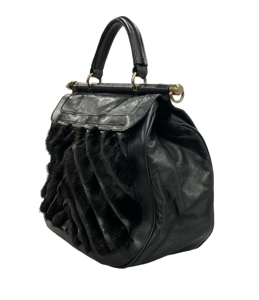 Borsa a mano Bally in pelle nera con manico singolo, chiusura girevole dorata e fasce di pelo scuro a punta sul fronte — vista 3