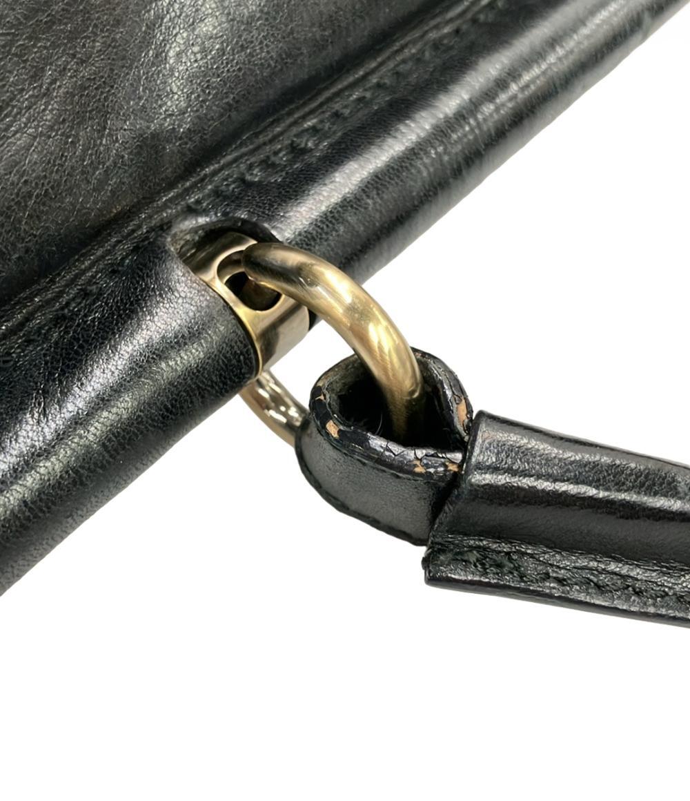 Borsa a mano Bally in pelle nera con manico singolo, chiusura girevole dorata e fasce di pelo scuro a punta sul fronte — vista 7