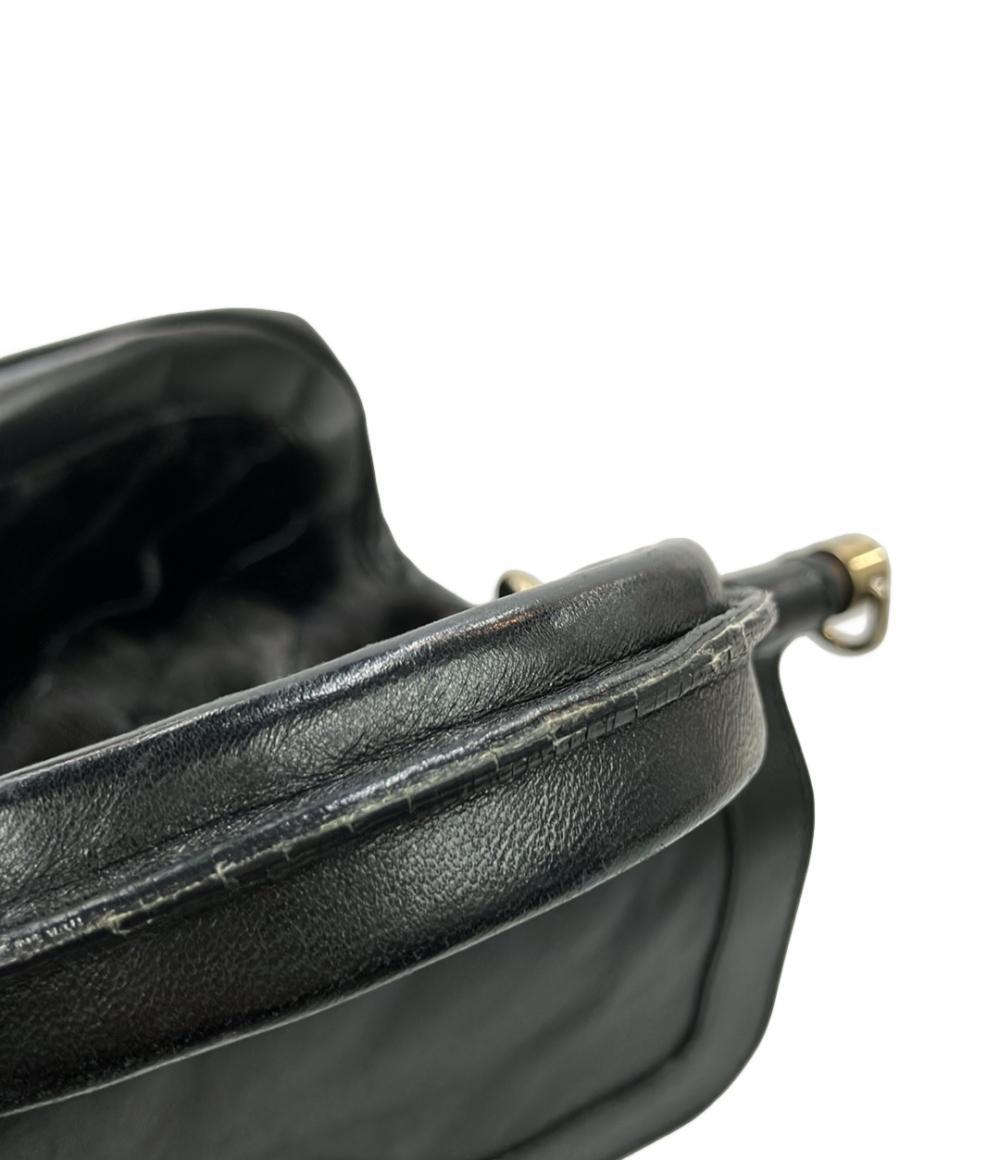 Borsa a mano Bally in pelle nera con manico singolo, chiusura girevole dorata e fasce di pelo scuro a punta sul fronte — vista 10