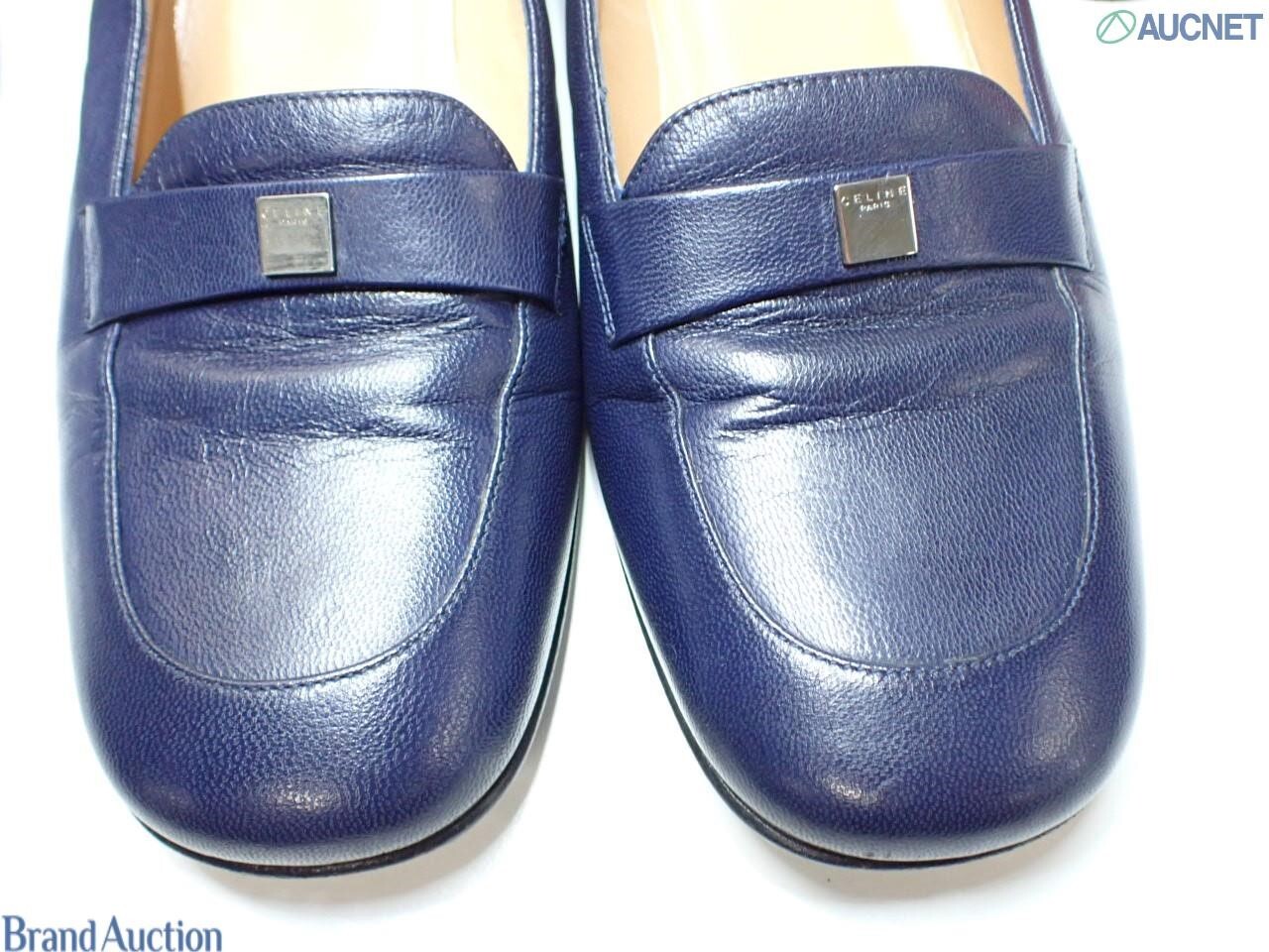 Mocassini Celine in pelle blu notte con fascetta e placchetta quadrata argentata.